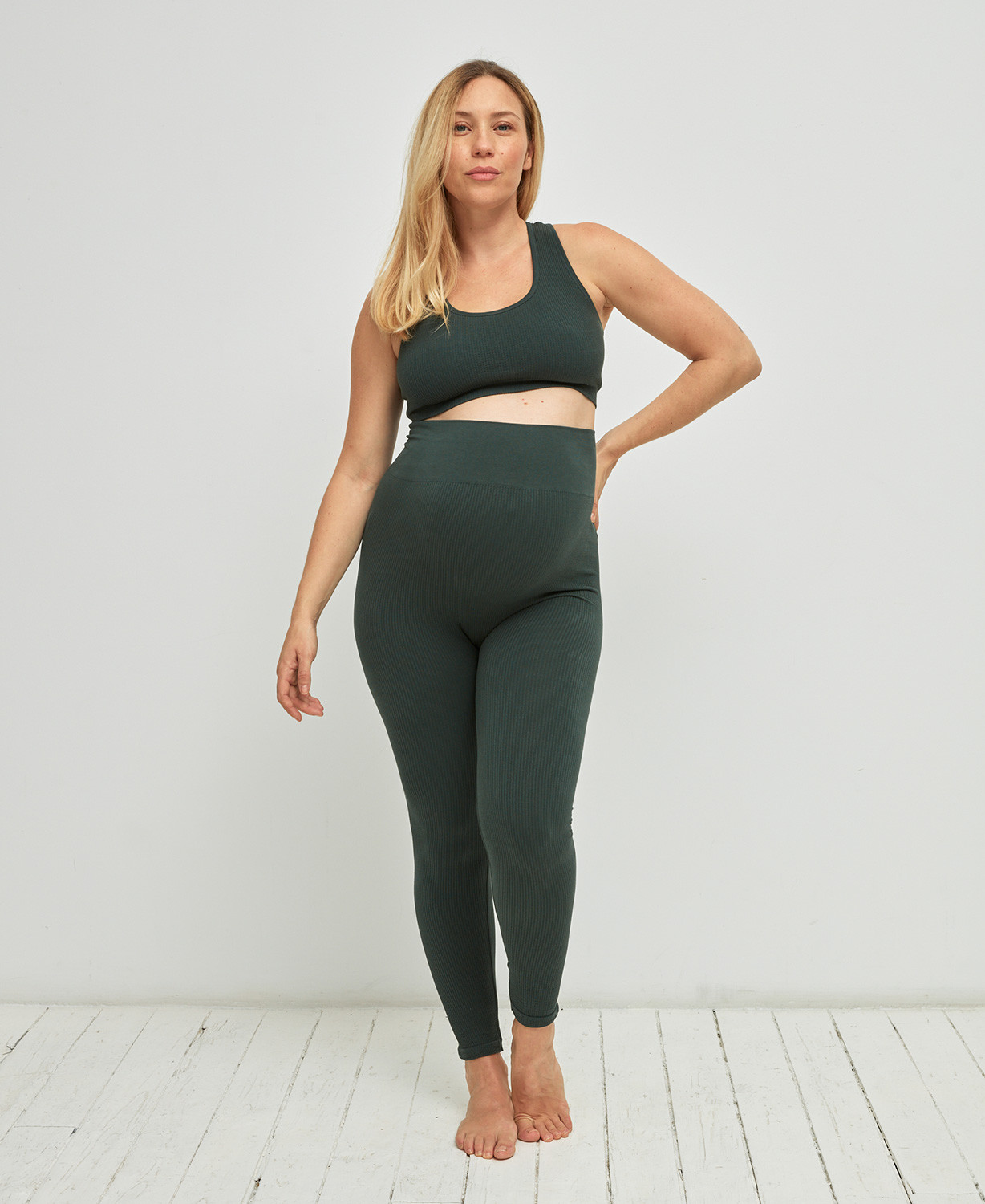 A premium seamless maternity band designed to hold up unbuttoned pants and  loose maternity wear, featuring a stay-put silicone strip.